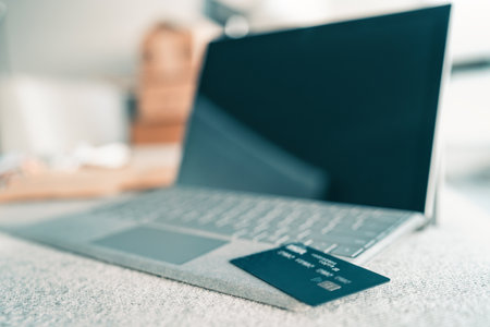 Online shopping on laptop at home concept. Credit card payment with computer over the internet. Technology device web securityの写真素材