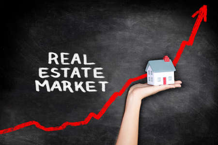 Real estate housing market bubble inflation. Red arrow on chart graph showing increase of price of houses in Canada, UK, USA, Australia. Borrowing purchase power and increasing household debt.の写真素材