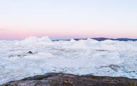 Global Warming and Climate Change. Iceberg from melting glacier in Ilulissat, Greenland. Aerial...