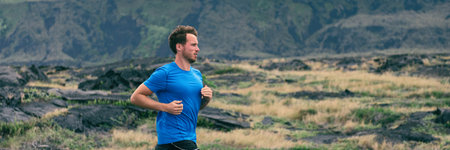 Runner jogging panoramic banner background. Sport running man in cross country trail run. Male athlete exercising and training outdoors in beautiful mountain nature landscapeの写真素材