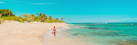 Beach panoramic travel banner of woman tourist walking alone on secluded shore in tropical Caribbean...