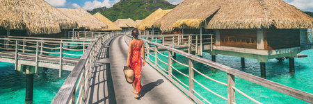 Luxury travel vacation destination panoramic banner. Romantic honeymoon getaway in overwater bungalows villas of Tahiti resort, Bora Bora, French Polynesia. Landscape copy space panorama.の写真素材