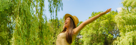 Allergy concept photo. Woman free of pollen allergy happy cheerful outdoors enjoying to be free of sneezing, runny nose and other pollen allergy symptoms by help of antihistaminesの写真素材