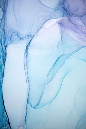 Alcohol ink sea texture. Artistic bright splash. Liquid artwork. Abstract ethereal swirl. Fragment of artwork. Trendy modern art. Inspired by the sky, as well as steam and smoke.の写真素材