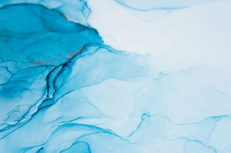 The picture is painted in alcohol ink. Abstraction will perfectly fit into a modern interior. Closeup of the painting. Colorful abstract painting background. Highly-textured paint.の写真素材