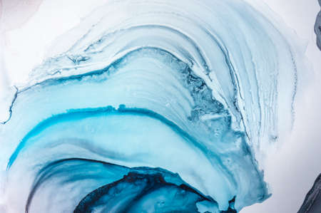 Alcohol ink. Artistic bright splash. Liquid artwork. Purple marble texture. Abstract ethereal swirl....