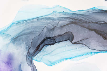 Abstract created using the technique of Alcohol ink. Macro photography of the smallest details of a panting. The panting shows how overflows of shades and colors of paint resemble space motifs.の写真素材