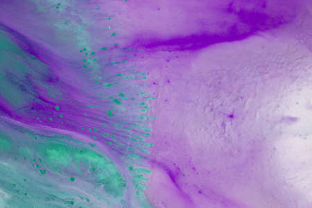 Abstract fluid acrylic painting. Marbled blue abstract background. Liquid marble pattern. Hand painted background with mixed liquid blue and green paints. Modern art.の写真素材