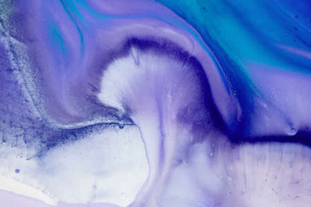 Abstract fluid acrylic painting. Marbled blue abstract background. Liquid marble pattern. Hand painted background with mixed liquid blue and green paints. Modern art.の写真素材