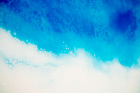 Applicable for design cover, annual report, invitation, flyer, presentation, packaging, poster, business card, wedding invitations. Macro photo of colorful abstract epoxy resin painting.の写真素材