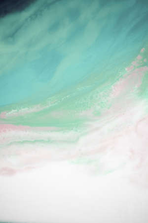 Liquid flow texture paint. modern art background. abstract epoxy resin painting. Green waves with...