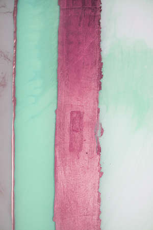Liquid flow texture paint. modern art background. abstract epoxy resin painting. Green waves with...