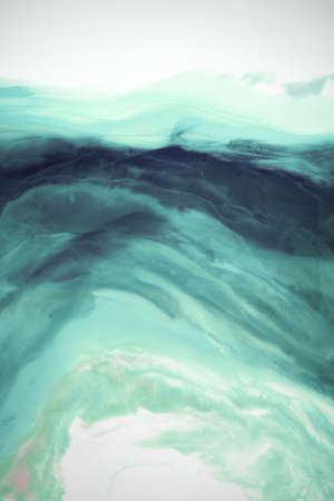 Liquid flow texture paint. modern art background. abstract epoxy resin painting. Green waves with...