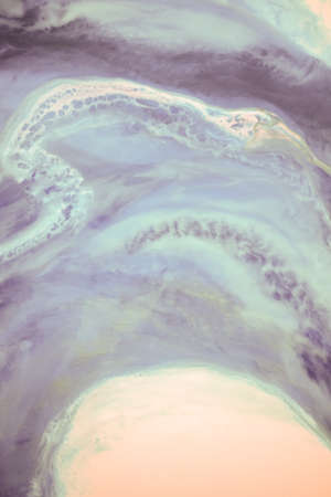 Liquid flow texture paint. modern art background. abstract epoxy resin painting. Green waves with...