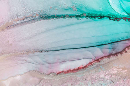 Abstract fluid art painting in alcohol ink technique, mixture blue, red and gold paints. Marble stone glowing golden veins. High resolution. Frozen paint mixes, weaves incredible patterns and spots.の写真素材
