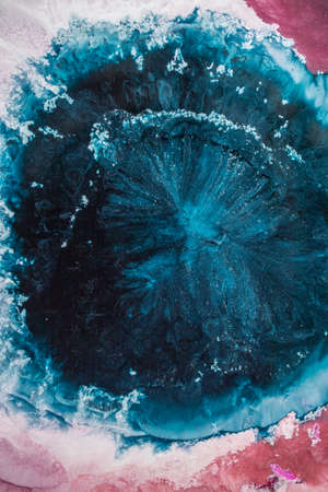 Petri art - a modern technique in painting, is created by adding alcoholic ink to epoxy. Macro photo...