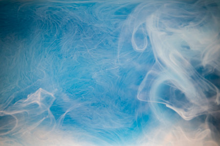 Abstract fluid acrylic painting. Marbled white abstract Ink cloud on blue background. Liquid marble...