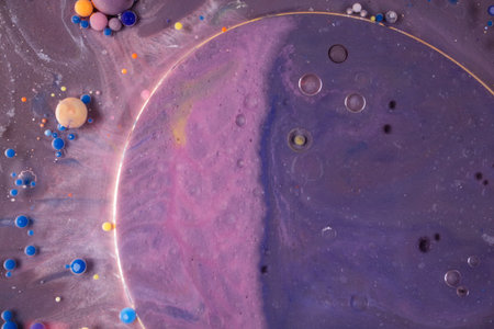 Acrylic paint balls abstract texture. Bright colors fluid, flowing wallpaper design. Purple, blue,...