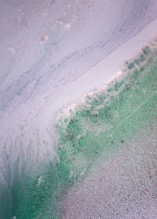 The picture is painted in alcohol ink. Creative abstract artwork made with translucent ink colors. Trendy wallpaper. Abstract painting, can be used as a background for wallpapers, posters, websites.の写真素材