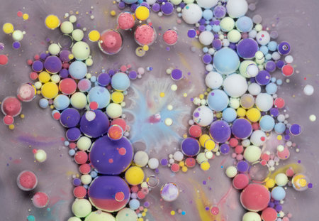 Colorful abstract art composition featuring vibrant spheres in a swirling pattern against a gray...