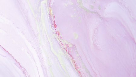 A soft blend of pastel pink and delicate gold veins in a marbled design creates an elegant abstract texture perfect for design projectsの写真素材