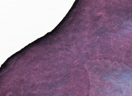 Watercolor art featuring deep purples and textured paper from a creative painting sessionの写真素材