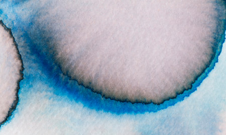 Watercolor artwork featuring fluid shapes and vibrant blue hues emphasizing abstract formsの写真素材