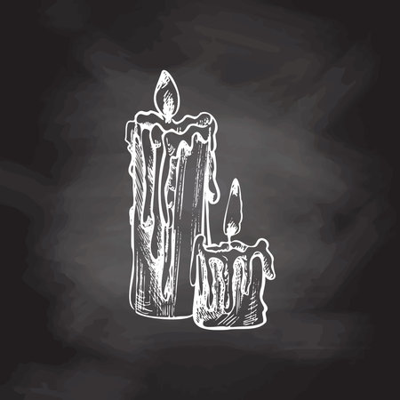 Hand drawn sketch of burning candles. Vector illustration of a vintage style. Halloween or Christmas drawing isolated on chalkboard background.のイラスト素材