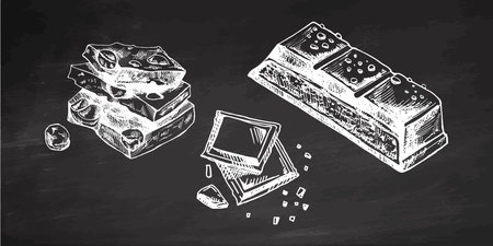 Hand-drawn chocolate bar and pieces vintage style illustration Vintage hand drawn chocolate pieces with nuts detailed illustration on chalkboard backgroundのイラスト素材