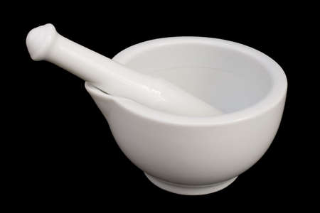 White mortar and pestle isolated on blackの写真素材