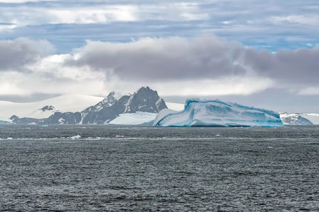 Antarctic landscape with icebergs and mountains in the background at Shingle Cove in the South Orkney Islandsの写真素材