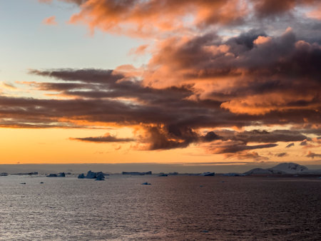 Sunset over Trinity Island in the Antarctic Peninsula, Antarcticaの写真素材