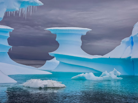 Fantastic iceberg formations and icicles at Cuverville Island in Antarcticaの写真素材