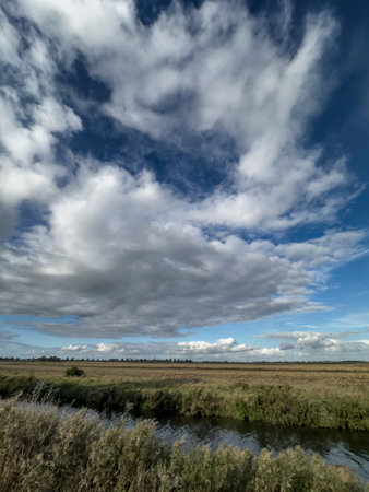 Fenland scene and agricultural landscape in Farcet Fen, Cambridgeshire, Englandの写真素材
