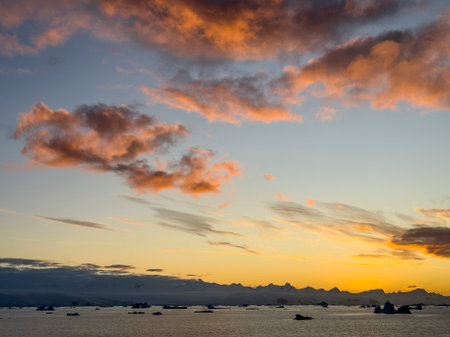 Sunset over Trinity Island in the Antarctic Peninsula, Antarcticaの写真素材