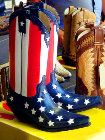 beautiful cowboy boots in the colors of the flag of the united states of americaの写真素材