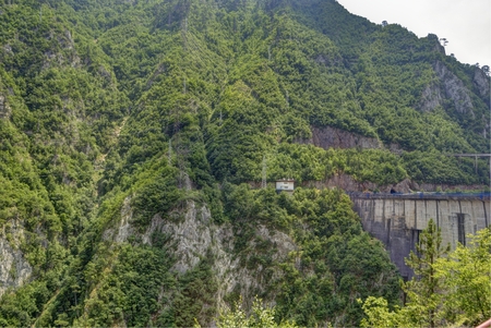 NEAR THE MRATINJE TOWN, MONTENEGRO JULY 19, 2015: Mratinje dam on the Piva river, near the Mratinje town, Montenegro. Dam was built in 1976 year. It's height is 220 m.のeditorial素材