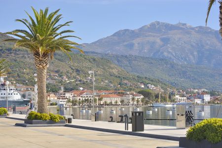 TIVAT, MONTENEGRO â NOVEMBER 2, 2017: Embankment of seaside Tivat town with Lovcen mountain in the background.のeditorial素材