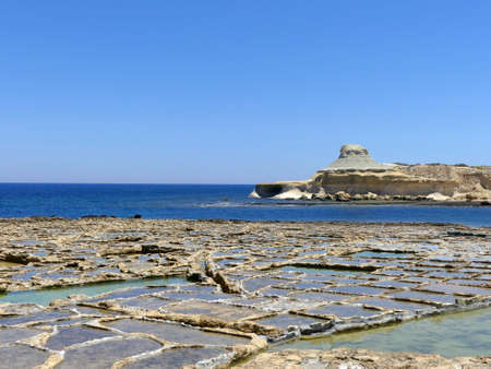 Salt pans at Marsalforn on Gozo, Malta with sea viewsのeditorial素材
