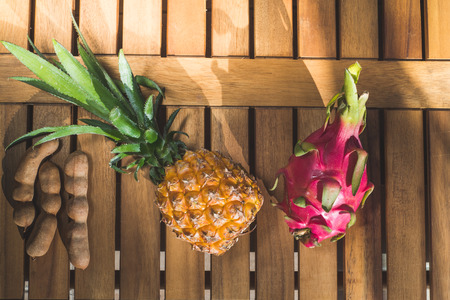 Beautiful Tropical Fruits on Wooden Backgroundの写真素材