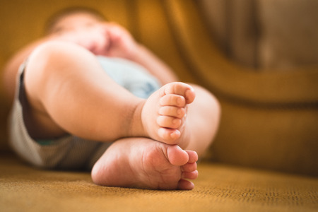 Cute tiny baby's feetの写真素材