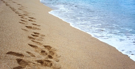 Footprints on the sand near the sea  Taken in Lloret de Mar, Spain の写真素材