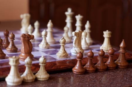 Playing chess  Some chess pieces off the boardの写真素材