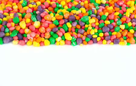 Multi color sugar dragee candies. Selective focus, main focus on the center. Copy space at bottom....