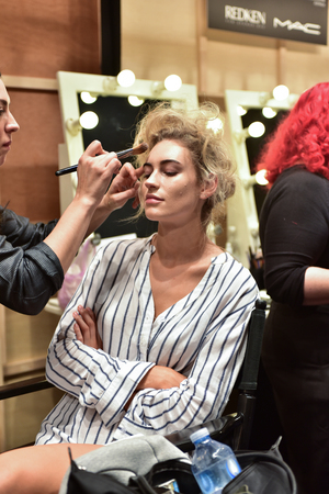 SYDNEY / AUSTRALIA - 20 May: Models stylists and makeup artists get prepared for show before Raffles International Showcase at Mercedes Benz Fashion Week Australia on 20 May 2016 in Carriageworks Sydneyのeditorial素材