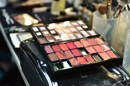 SYDNEY / AUSTRALIA - 20 May: Palette of lip balms of different color on a makeup table before House of Cannon fashiob show at Mercedes Benz Fashion Week Australia on 20 May 2016 in Carriageworks Sydneyのeditorial素材