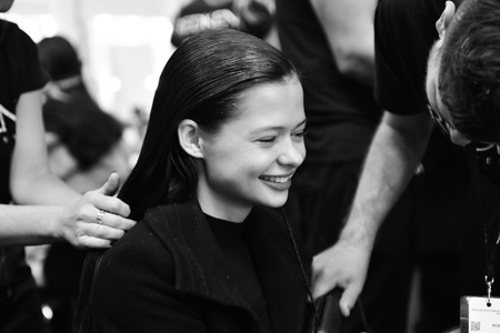 SYDNEY / AUSTRALIA - 20 May: Model is getting ready and being done a hair by a hair stylist for show before House of Cannon fashiob show at Mercedes Benz Fashion Week Australia on 20 May 2016 in Carriageworks Sydneyのeditorial素材