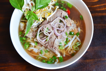 Fresh hot pho soup in a white bowl from traditional Vietnamese cuisineの写真素材