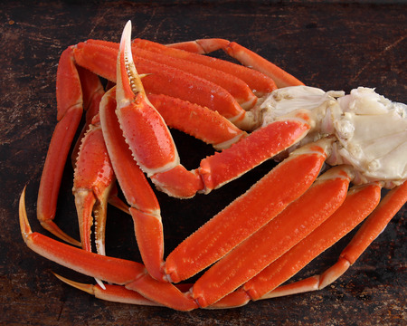 Crab legs on brown backgroundの写真素材