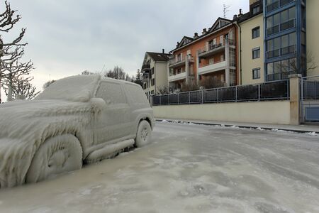 Car caught in the ice in Versoix Switzerland and coldの写真素材